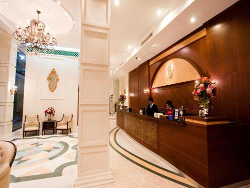 a lobby of a hotel with a reception desk at The Ecotel Bangkok in Bangkok