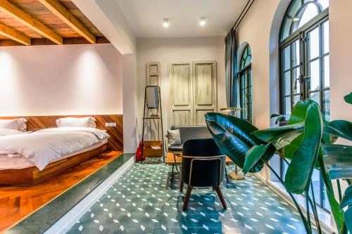 Ένα ή περισσότερα κρεβάτια σε δωμάτιο στο Mogan Mountain Fangu Boutique Villa