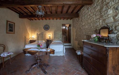 a room with two beds and a table in a room at Villa Il Paradisino in Sesto Fiorentino