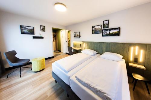 Postel nebo postele na pokoji v ubytování fjord hotel berlin