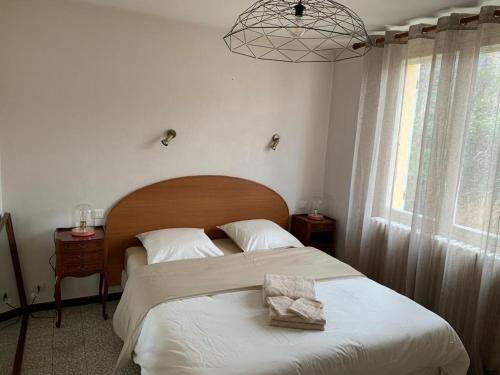 Posteľ alebo postele v izbe v ubytovaní Gîte Le Lavandin