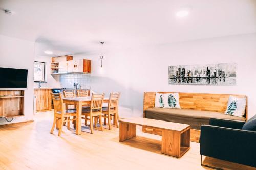 a living room with a couch and a table at Gut Hügle Erlebnishof in Ravensburg