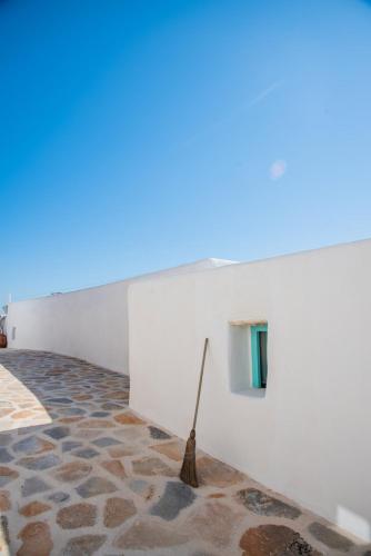 a museum with a stick on a wall at Dimitrakis Guesthouse in Donoussa