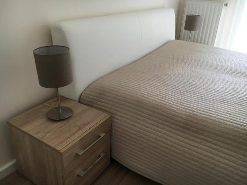 Ένα ή περισσότερα κρεβάτια σε δωμάτιο στο Aqua Apartman Superior