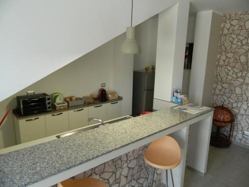 A kitchen or kitchenette at A Casa di Anna - Locazione Turistica -