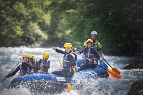 a group of people in a raft on a river at Club Alpina - Champagny-en-Vanoise in Champagny-en-Vanoise