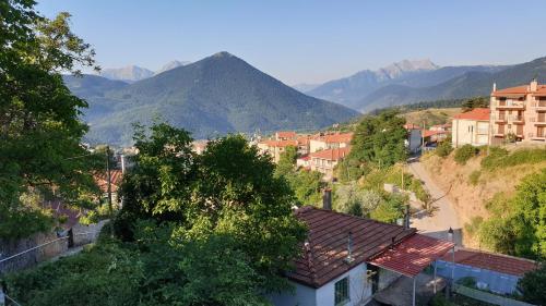 a view of a town with mountains in the background at The House in the Cobbled Road in Karpenision