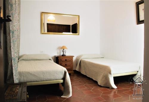 En eller flere senge i et værelse på Finca El Molino