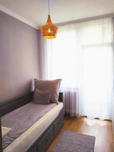 Postel nebo postele na pokoji v ubytování Lora Apartman