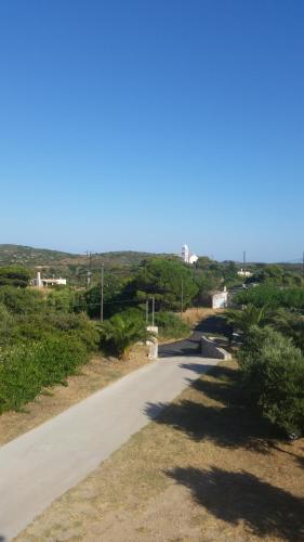 a road leading to the ocean on a sunny day at Emmanouil in Kythira