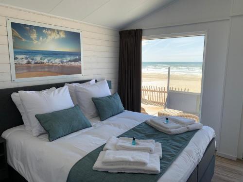 Postel nebo postele na pokoji v ubytování STRAND 21 hotelchalets