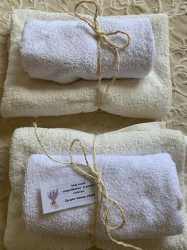 a group of towels with a tag on them at Apartament No. 2 in Łeba