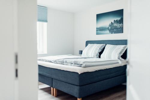 Ένα ή περισσότερα κρεβάτια σε δωμάτιο στο Ferienhaus Loheide - mit Sauna