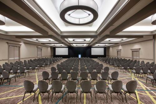 a large room with rows of chairs and a large chandelier at Crowne Plaza Atlanta - Midtown by IHG in Atlanta