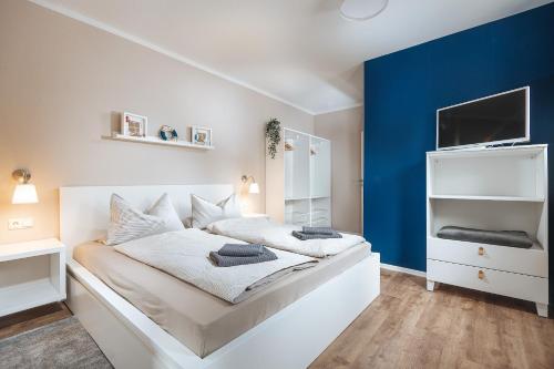 Ένα ή περισσότερα κρεβάτια σε δωμάτιο στο Apartments Am Erdbeerhof
