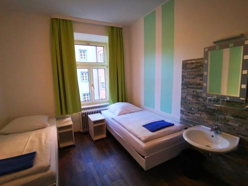 Postel nebo postele na pokoji v ubytování City Hostel