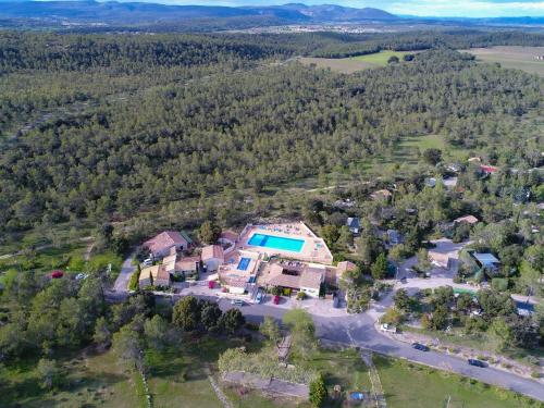 an aerial view of a large house with a swimming pool at Bungalow Claret in Vacquières