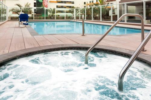 a hot tub in a hotel swimming pool at Wyndham Anaheim in Anaheim