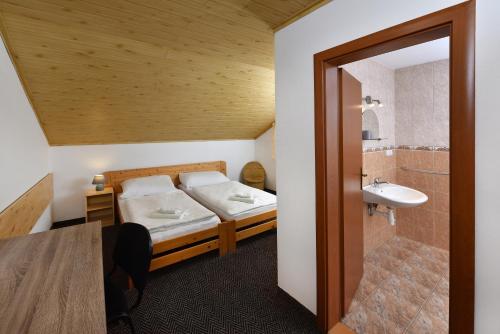 Ένα ή περισσότερα κρεβάτια σε δωμάτιο στο Vila Martina
