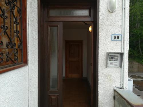 a door to a house with a sign on it at Casetta all'Abetone Jacopo e Sabrina in Abetone