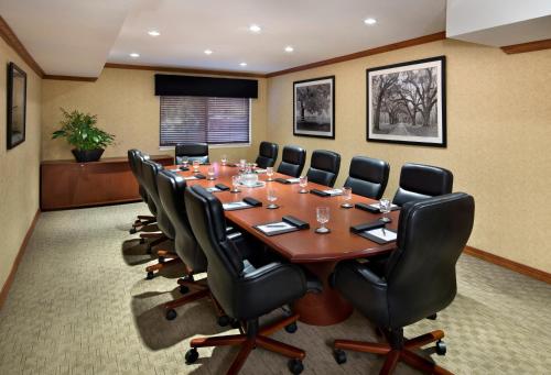 a conference room with a long table and chairs at Maple Tree Inn in Sunnyvale