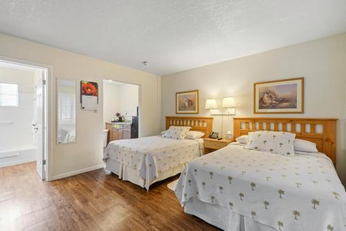 Cama o camas de una habitación en Tequesta Palms Inn