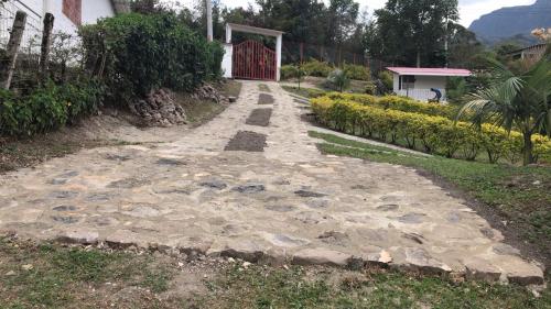 a stone path leading up to a house at Finca Villa Elenita in Sasaima
