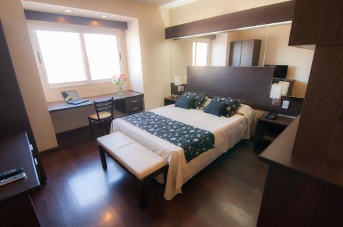 Ένα ή περισσότερα κρεβάτια σε δωμάτιο στο Hathor Hotels Mendoza