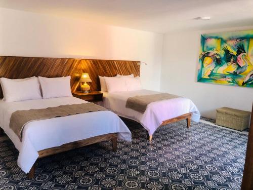 Postel nebo postele na pokoji v ubytování NaNa Vida Hotel Morelia