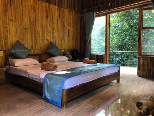 Кровать или кровати в номере LePont Mu Waterfall Bungalow