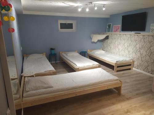 Säng eller sängar i ett rum på Olive Hostel