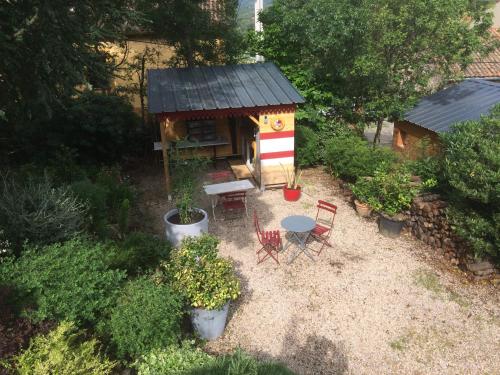 an overhead view of a small house with a table and chairs at Les deux chemins in Mons