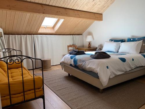 Postel nebo postele na pokoji v ubytování La Ferme de Chateauvieux