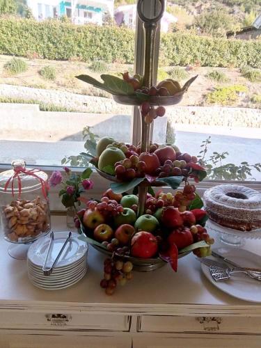 a display of fruits and vegetables on a table at Ktima Noosfera Wellness & Retreat Center in Nees Vrisoules