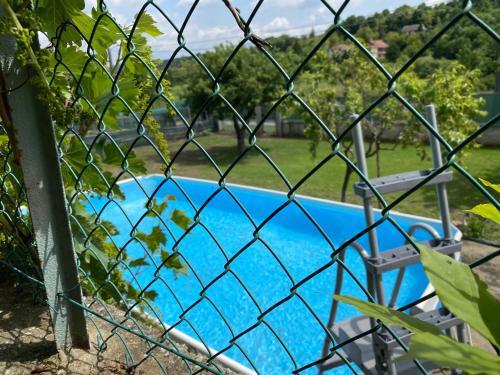 a fence in front of a swimming pool at Oca Carolina in Buttigliera Alta