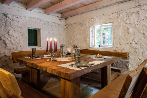 a wooden table in a room with candles on it at Hotel Lindenhof Hubmersberg in Pommelsbrunn