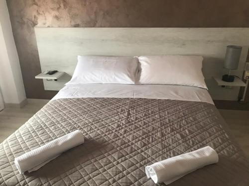 Postel nebo postele na pokoji v ubytování Albergo Ristorante Uspa