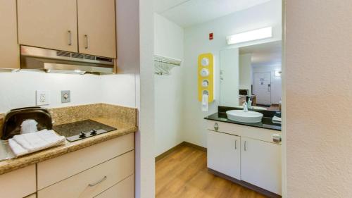 a kitchen with a sink and a counter top at Motel 6-Norfolk, VA in Norfolk