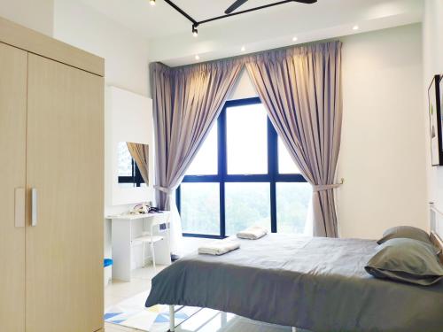 a bedroom with a bed and a large window at Le Pavilion by Salaam Suites, 5 pax, near Setiawalk in Puchong