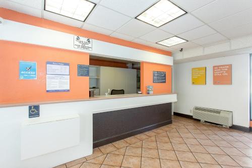 a waiting room with a counter and a mirror at Cathedral Hill Hotel in San Francisco