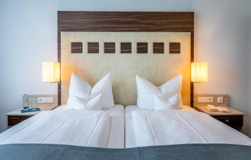 Katil atau katil-katil dalam bilik di AVALON Hotel Bad Reichenhall
