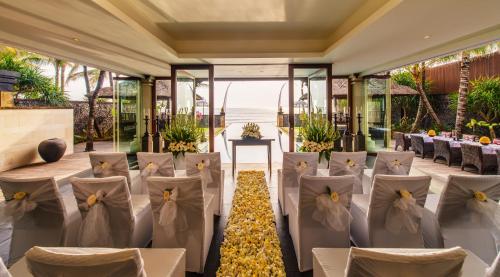 a set up for a wedding in a room with chairs at The Legian Seminyak, Bali in Seminyak