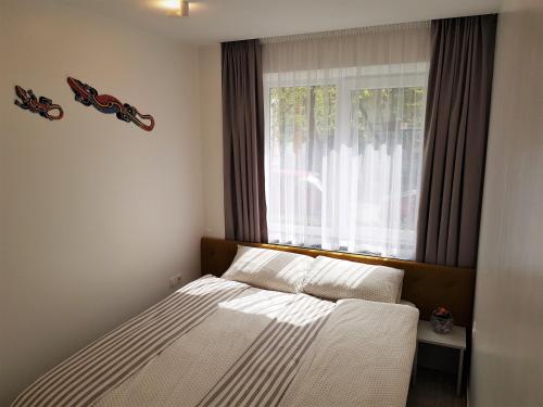 Una cama o camas en una habitación de Apartment For You