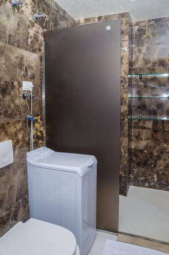 a bathroom with a toilet and a shower at Apartments Menuet in Budva