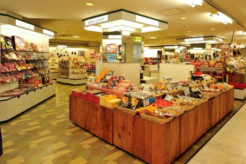 a grocery store aisle with a display of food at Ibusuki Seaside Hotel in Ibusuki