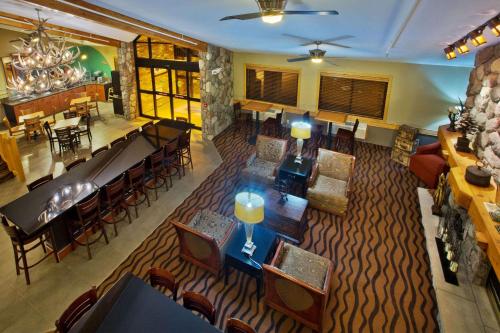 an overhead view of a restaurant with tables and chairs at AmericInn by Wyndham Grand Forks in Grand Forks
