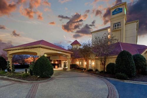 a rendering of a hotel with a building at La Quinta by Wyndham Winston-Salem in Winston-Salem
