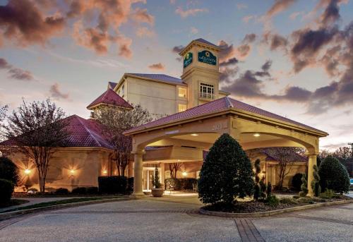a building with a clock tower on top of it at La Quinta by Wyndham Winston-Salem in Winston-Salem