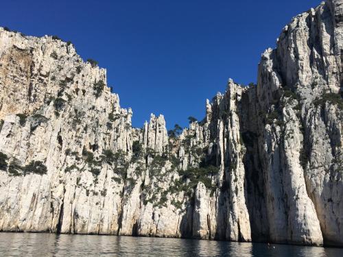 a rocky mountain with a blue sky in the background at BOUTIQUE HOSTEL BY Cassis in Cassis