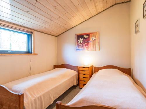 a bedroom with two beds and a window at 5 person holiday home in Nørre Nebel in Nørre Nebel